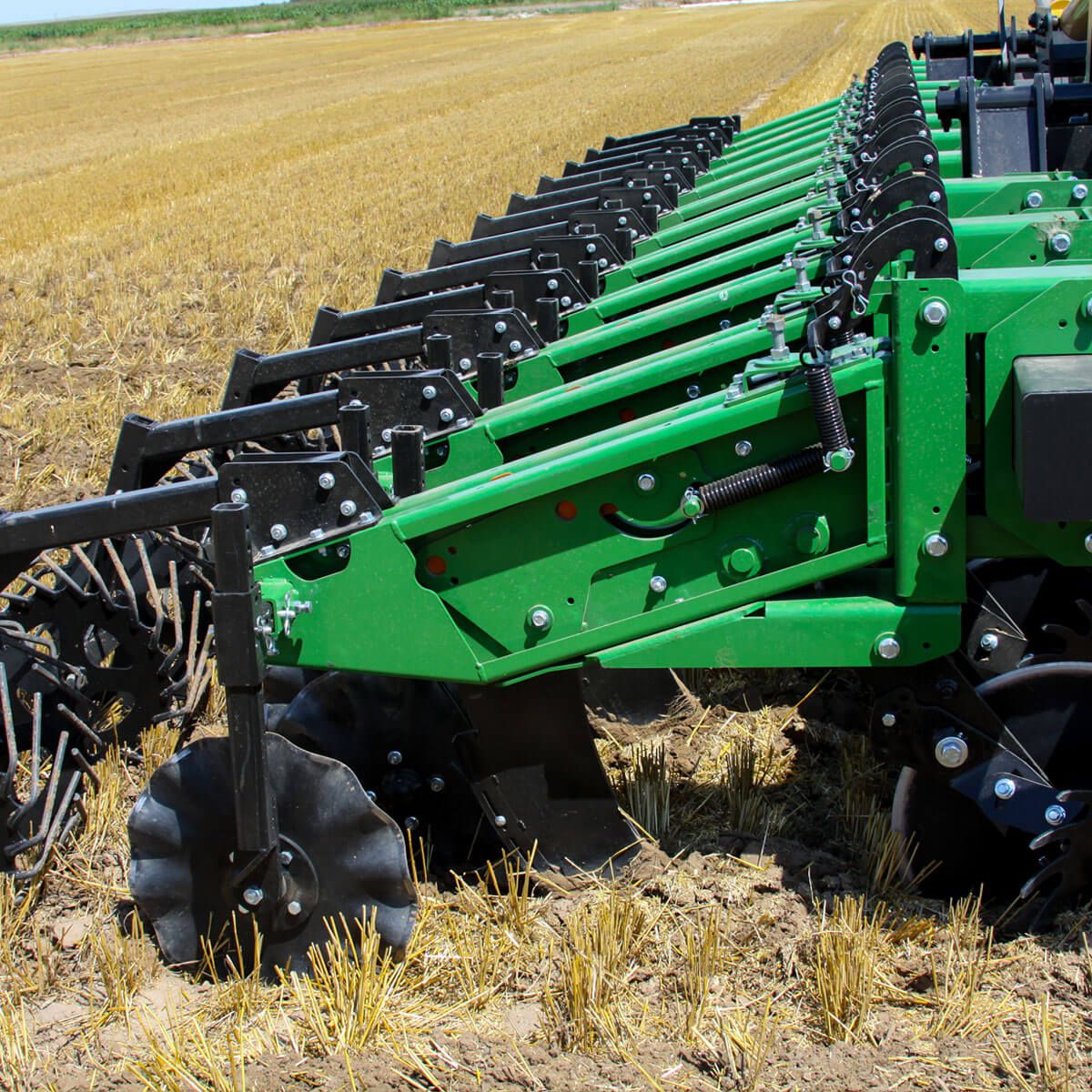 Dirty Schlagel Posi-Close Planter Wheels mounted on John Deere planter